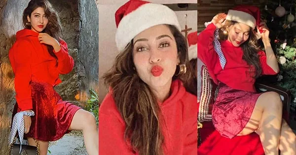 Sonarika Bhadoria in red hoodie with rosy red lips celebrates Christmas.