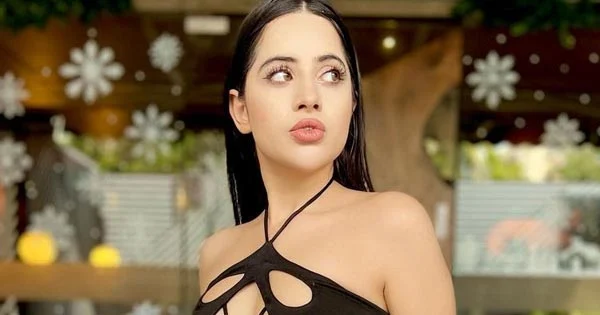 Urfi Javed in a risky high slit black dress sets social media on fire.