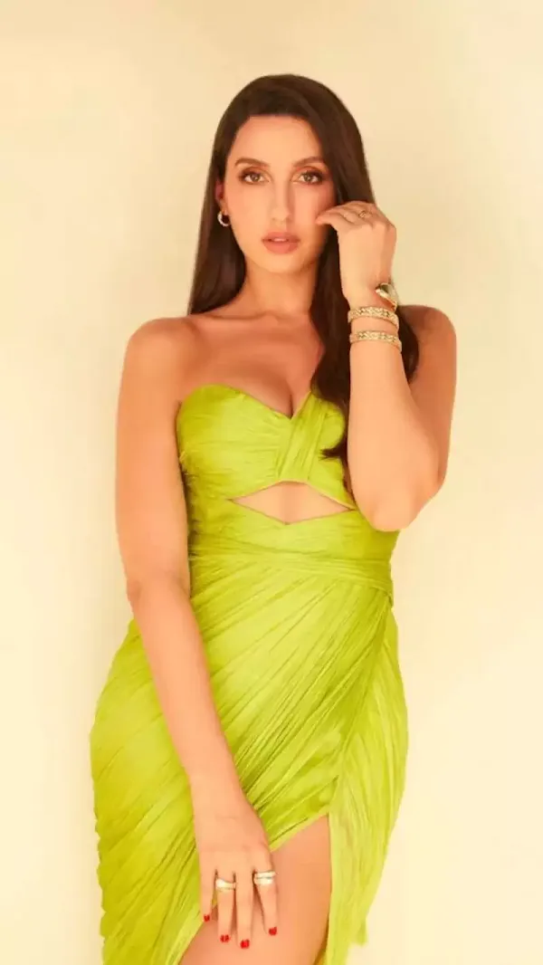 nora fatehi cleavage green dress