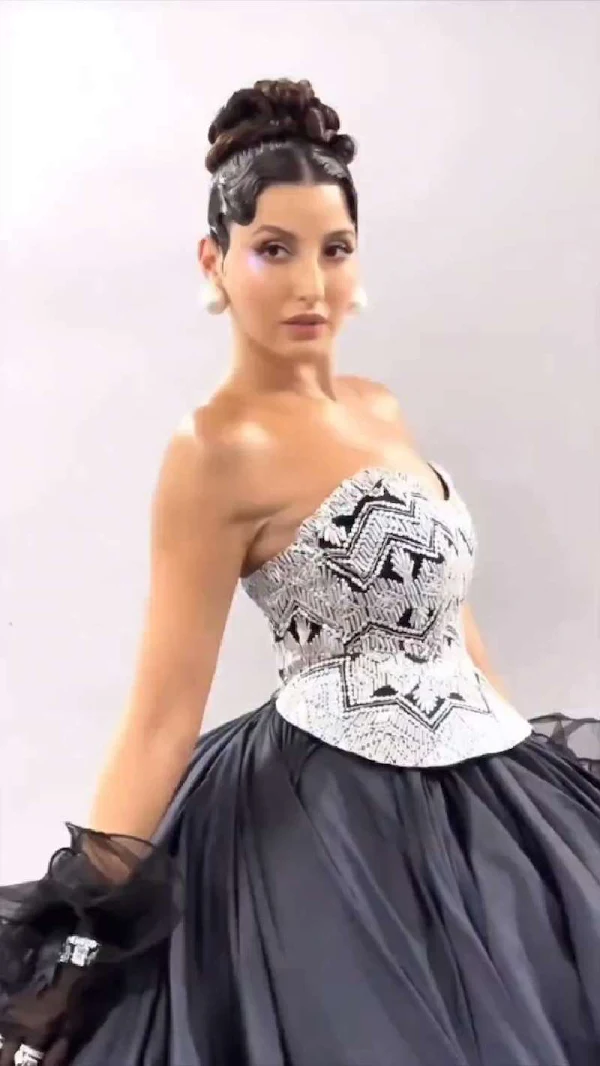 nora fatehi cleavage off shoulder dress curvy