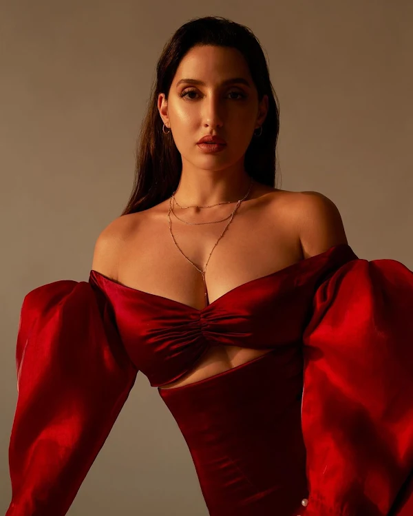 nora fatehi cleavage red dress busty bollywood