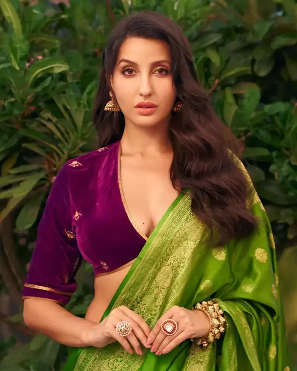 nora fatehi green saree deep neckline blouse