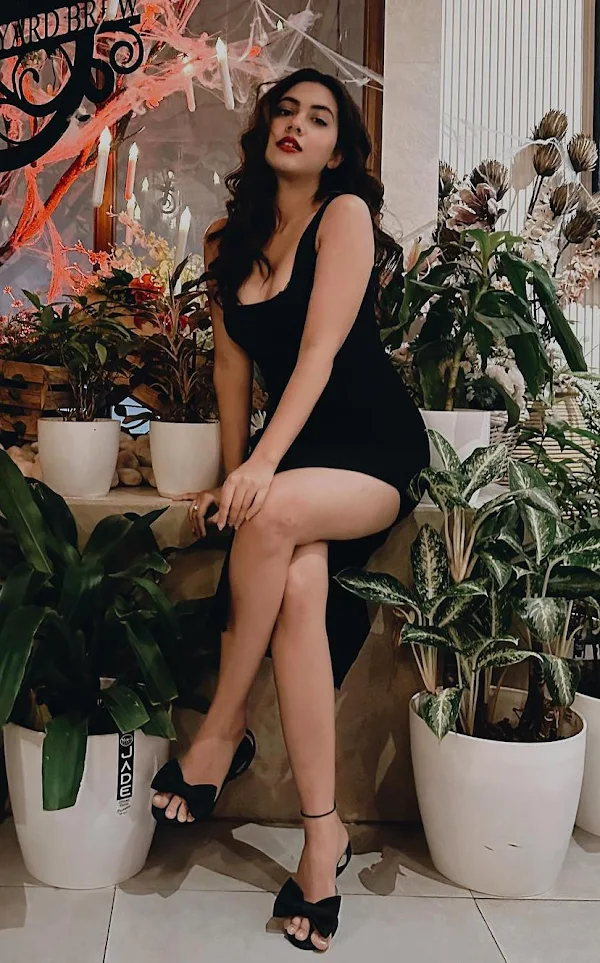 reem sameer sexy legs black high slit dress