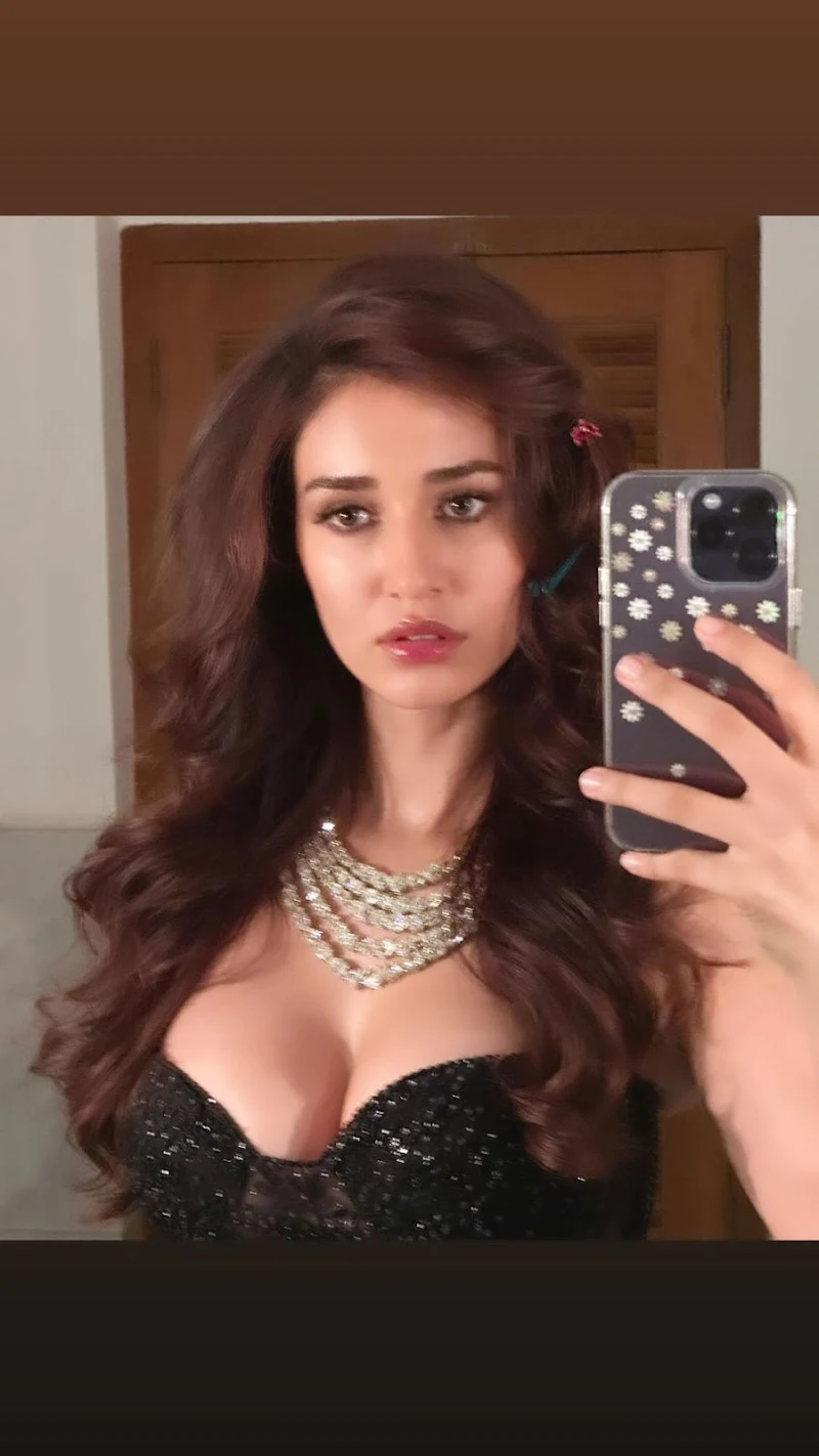 Disha Patani cleavage black dress high slit