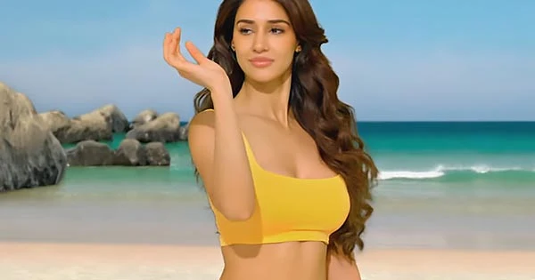 Disha Patani rocks a plunging neckline crop top and high slit skirt in latest ad – watch video.