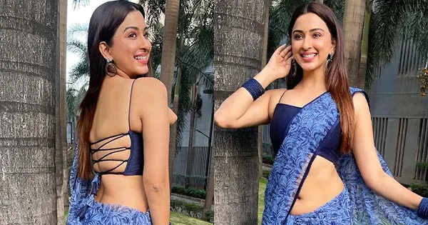 Esshanya Maheshwari flaunts her voluptuous midriff in low waist blue saree.