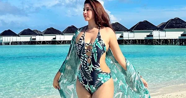 Esshanya Maheshwari green swimsuit cleavage curvy legs