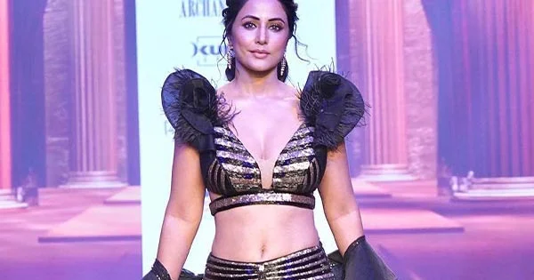 Hina Khan slayed in this deep neckline top with navel baring long skirt at Times Fashion Week.