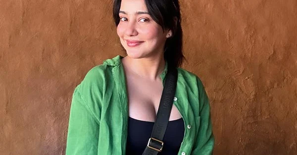 neha sharma cleavage black top green shirt