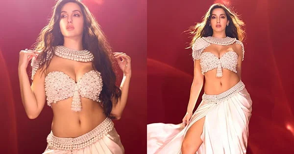 Nora Fatehi is too hot to handle in this cleavage baring skimpy pearl top revealing her fine midriff – see now.