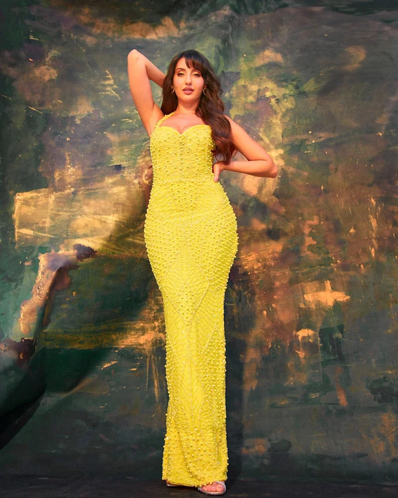 Nora Fatehi cleavage curvy yellow tight dress