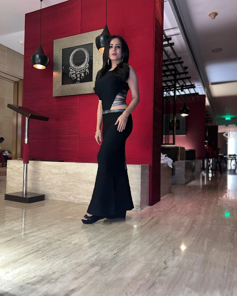 Puja Banerjee black dress curvy figure