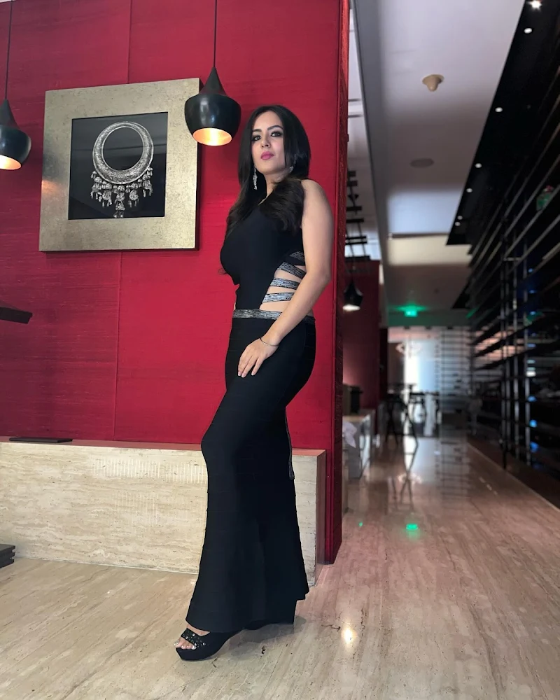 Puja Banerjee black dress curvy figure