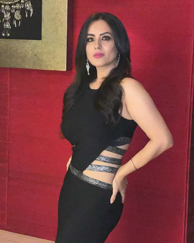 Puja Banerjee black dress curvy figure