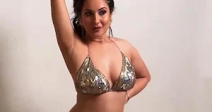 Puja Banerjee in tiny top flaunting ample cleavage and curvy figure  – see new photos and video.