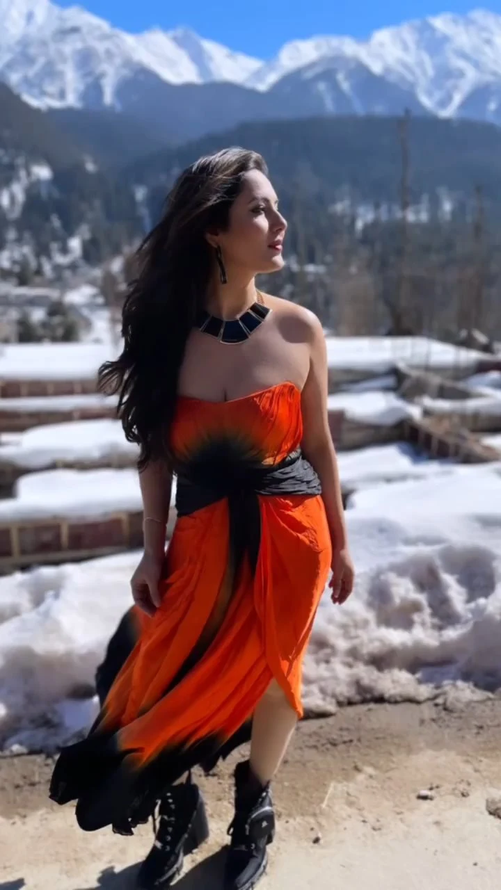 Puja Banerjee cleavage orange dress