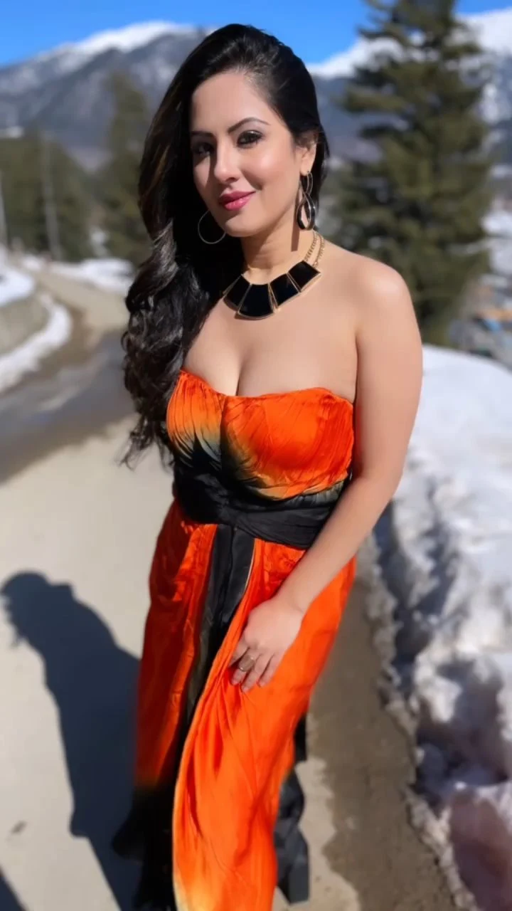 Puja Banerjee cleavage orange dress