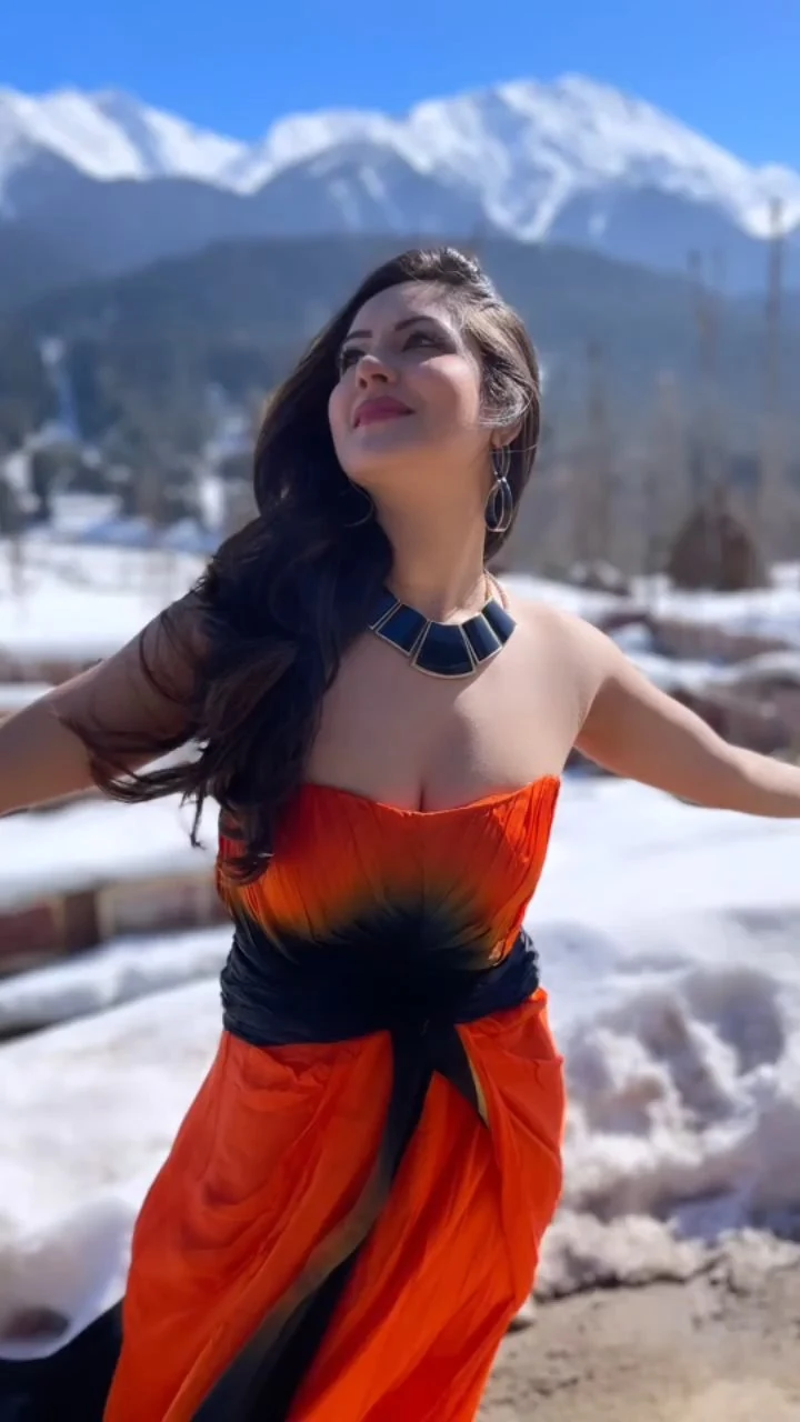 Puja Banerjee cleavage orange dress