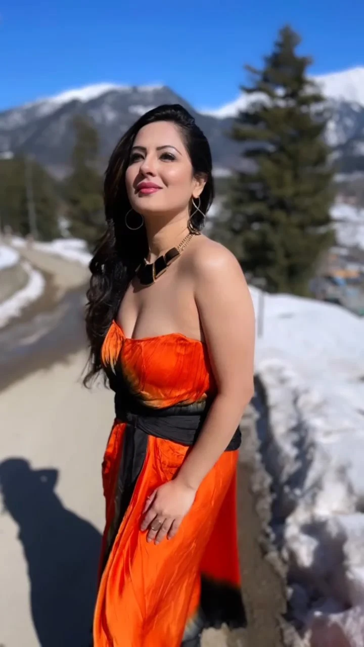 Puja Banerjee cleavage orange dress