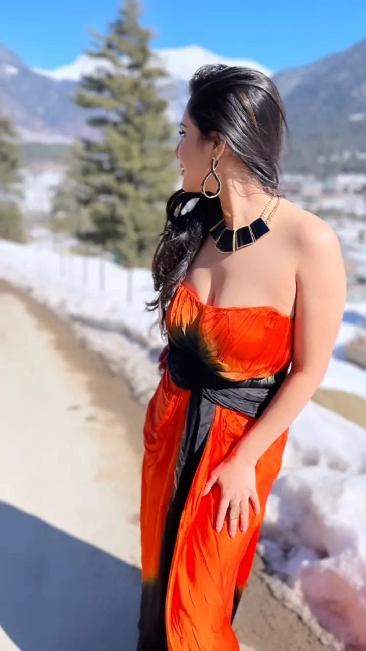 Puja Banerjee cleavage orange dress