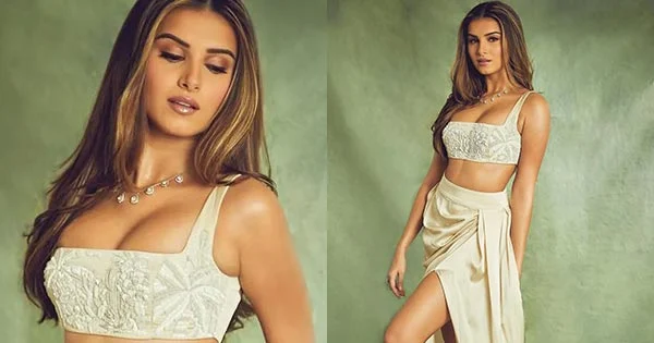 Tara Sutaria in a cleavage baring top and thigh high slit skirt sets temperature soaring.