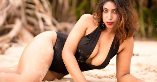 Neelam Singha black swimsuit curvy model cleavage sexy legs