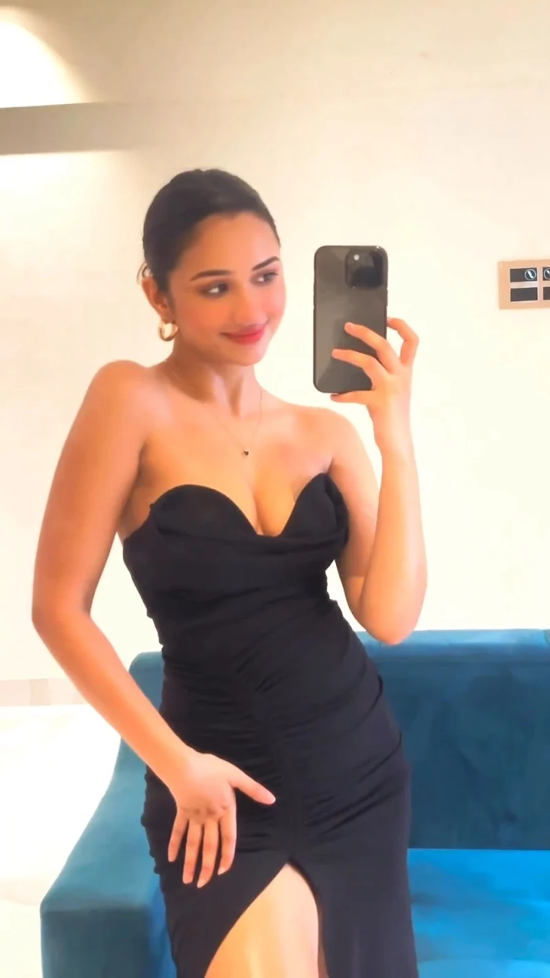 Akanksha Sharma sexy legs cleavage black high slit dress