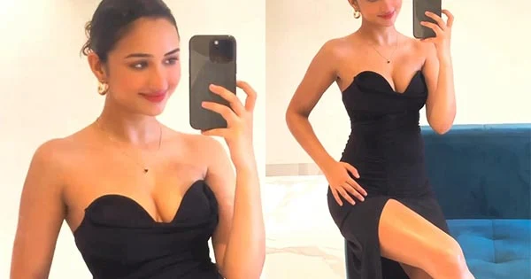 Akanksha Sharma sexy legs cleavage black high slit dress