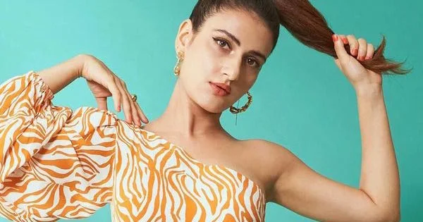 Fatima Sana Shaikh in one sleeve short dress with high pony tail makes fans crazy.