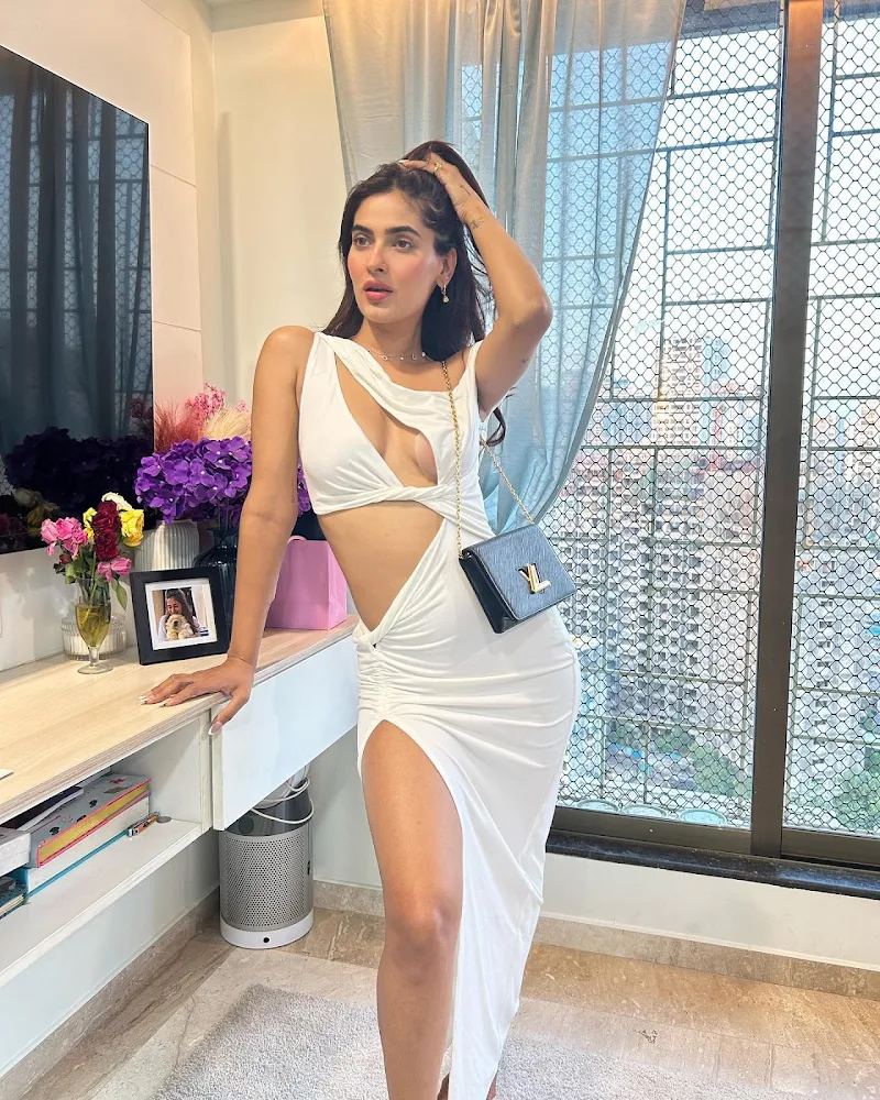 Karishma Sharma high slit white dress sexy legs