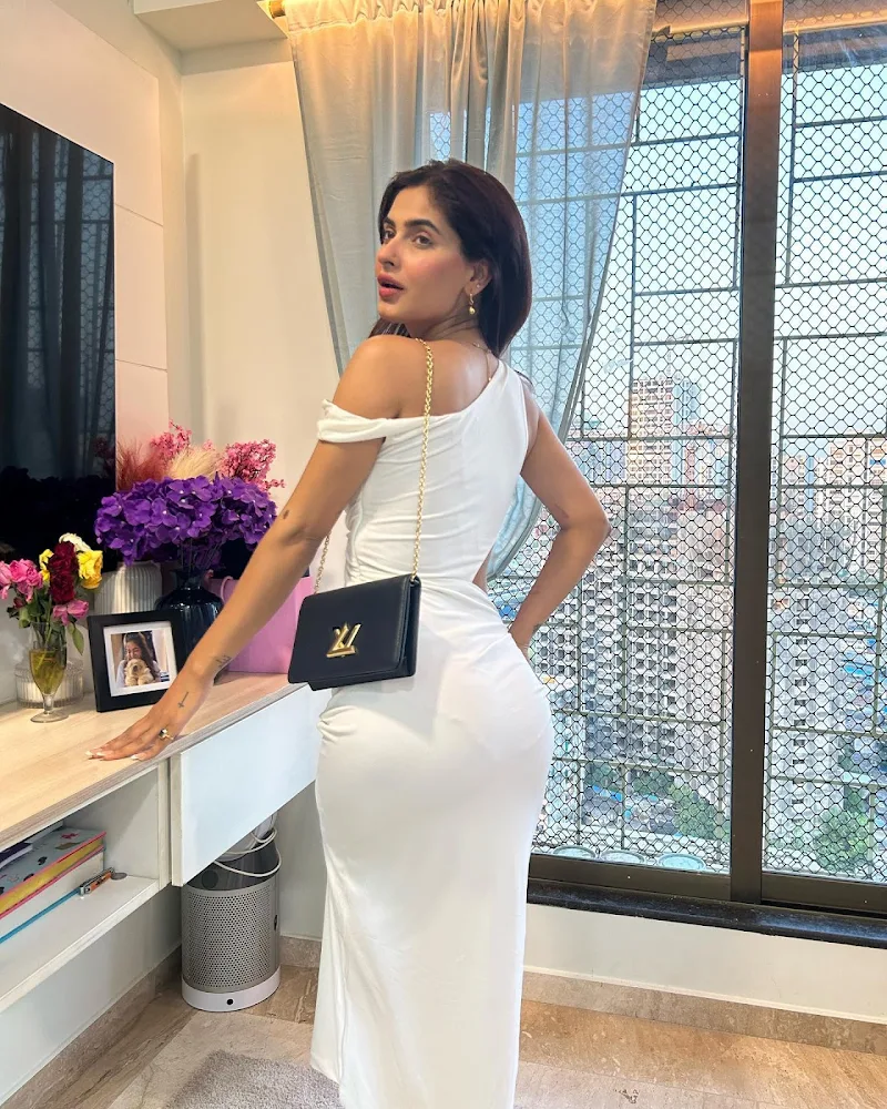 Karishma Sharma high slit white dress sexy legs