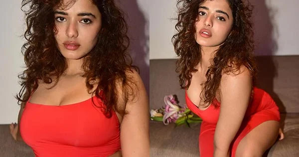 Ketika Sharma in cleavage baring high slit red dress flaunts her sexy legs and curvy figure.