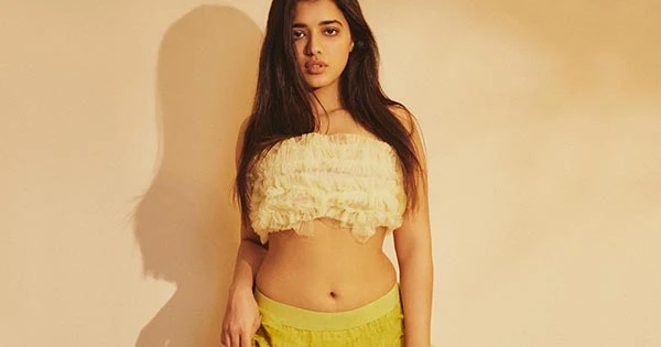 Ketika Sharma turns the heat up with her fine curves in a tube top and navel baring long layered skirt.