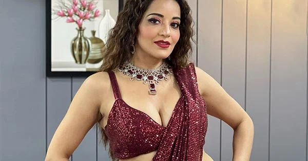 Monalisa puts a busty display in shimmery saree with tiny blouse – see pics.