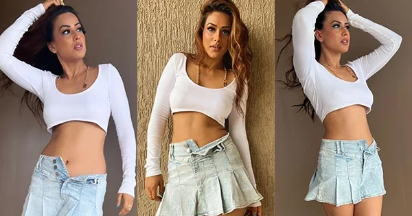 Nia Sharma in skimpy crop top with mini denim skirt flaunts her sexy legs and fine midriff – see now.