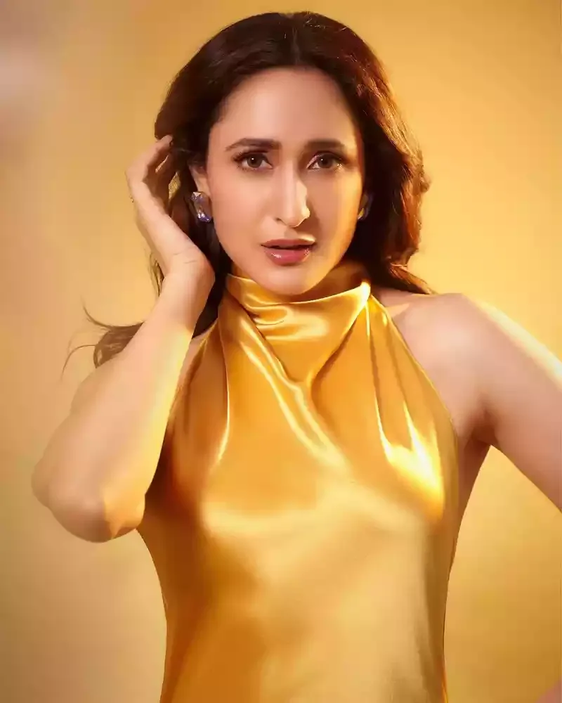 pragya jaiswal golden dress sexy face