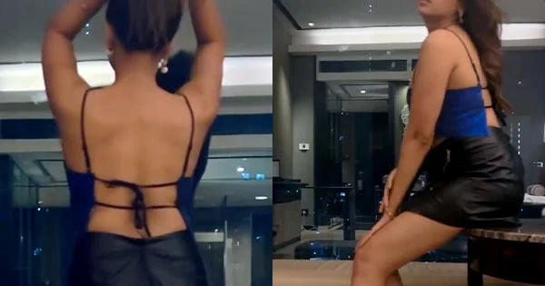 Indian actress flaunting her sexy back and toned legs in short skirt and skimpy top – watch video.