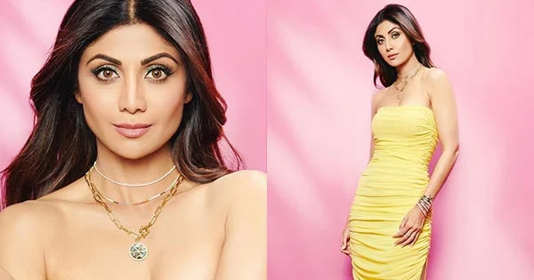 Nikamma actress, Shilpa Shetty, flaunts her toned figure in a body hugging yellow dress.