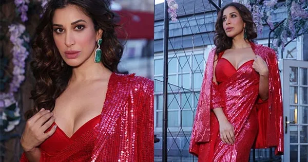 Sophie Choudry in this shimmery red saree with cleavage baring blouse and matching jacket – see hot photos.