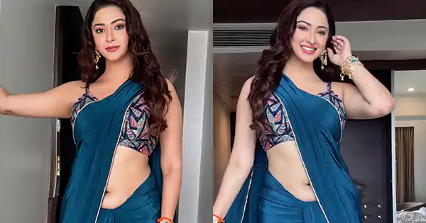 Esshanya Maheshwari in navel baring blue saree with sleeveless blouse is simply stunning.