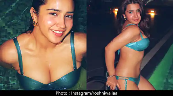 Roshni Walia in bikini enjoying an evening in pool and flaunting her fine figure.