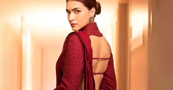 Kriti Sanon in maroon saree with full sleeve backless blouse turned heads.