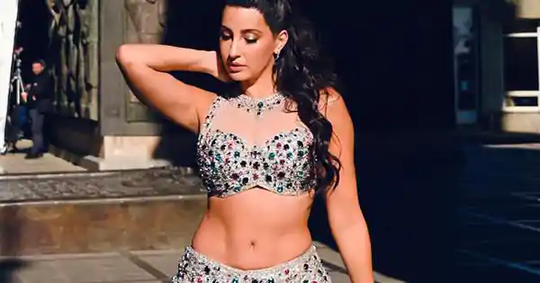 Nora Fatehi in skimpy top with short skirt flaunting her fine figure – new pics from Payal song (behind the scenes).