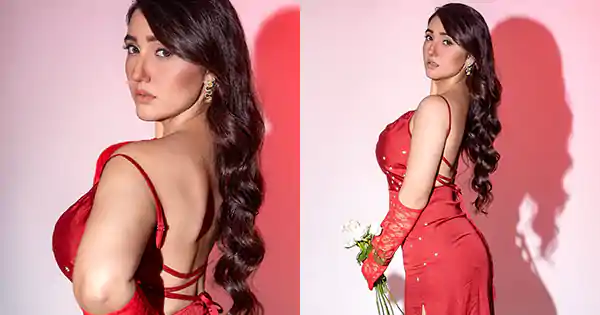 Ashnoor Kaur in red high slit backless dress raises the temperature in style.