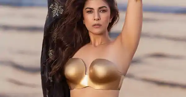 Nimrat Kaur in tiny golden blouse with black saree oozed much oomph for this beach photoshoot.